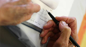 Hand writing a check