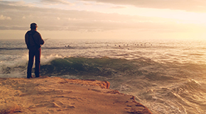 Man Overlooking Ocean