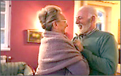 Elderly couple dancing.