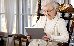 Senior browsing on an iPad