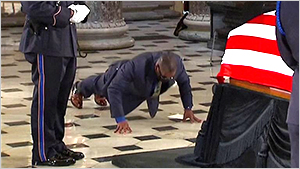 Trainer at Ginsburg casket doing pushups