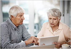 Elder couple on laptop