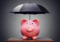 Piggy bank with umbrella over it