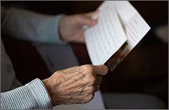 Elder reading a letter