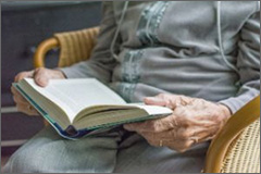 Elder reading a book
