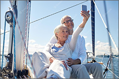 Senior couple on sail boat