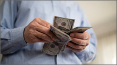 Elder counting cash