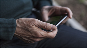 Older man checking his phone