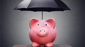 Piggy bank under an umbrella