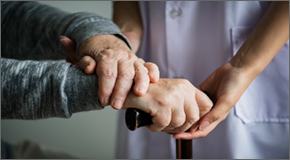 Elderly man hands with health care aid