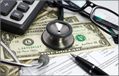Stethoscope sitting on top on money and health form