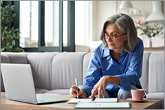 Older woman working on laptop