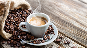 Cup of coffee with beans