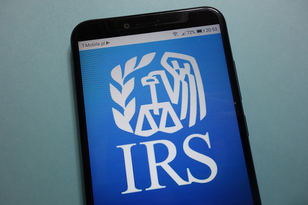 IRS logo on cell phone screen.