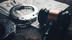 Handcuffs, money and gavel